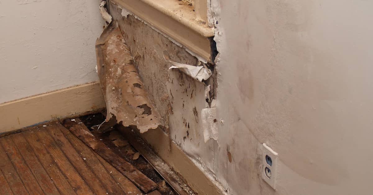 Water damage to the interior wall of a home | ATI Restoration