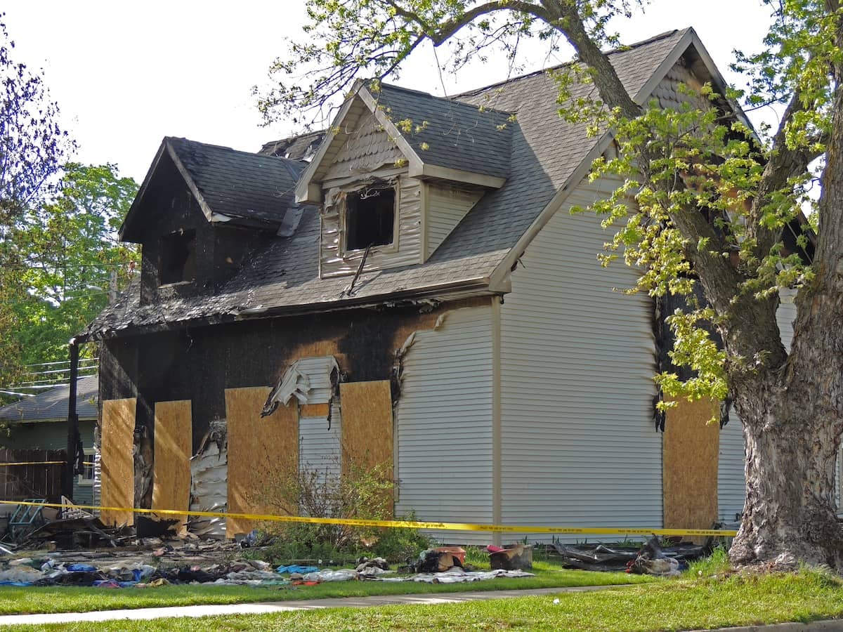 House boarded up after a major fire | ATI Restoration