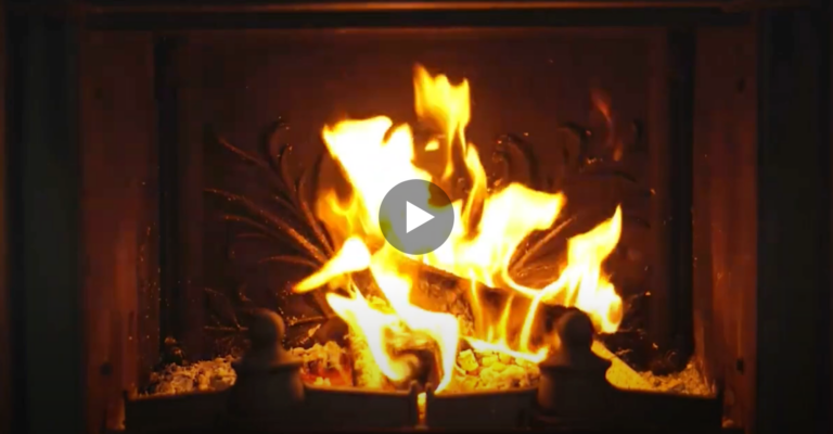 Video of a fire burning in a fireplace.