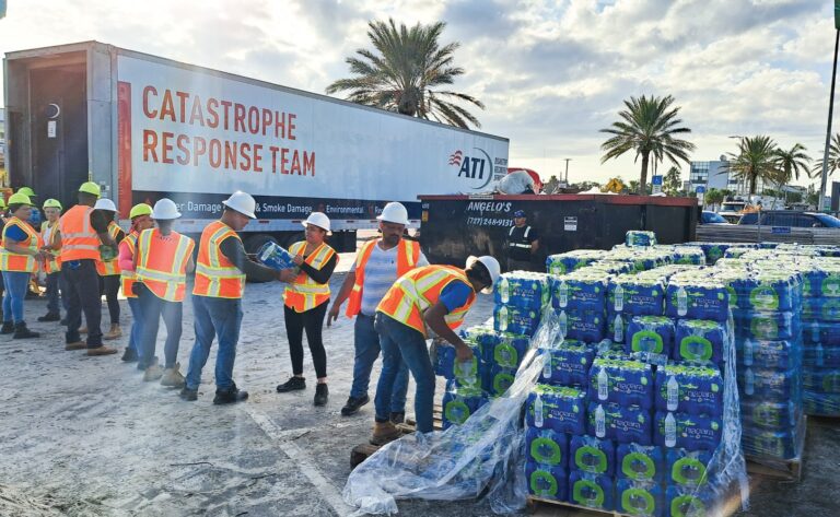 Disaster relief workers distributing bottled water.
